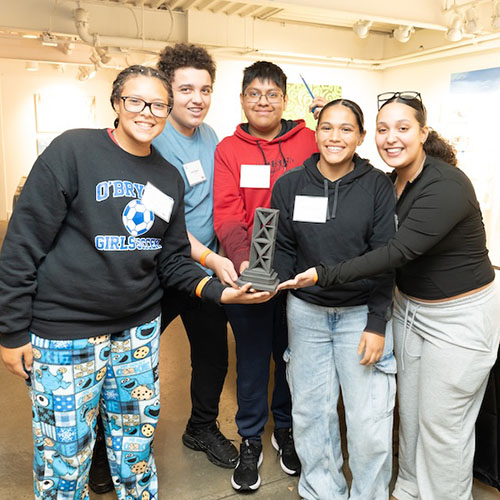 A FastForge team smiling and holding their trophy